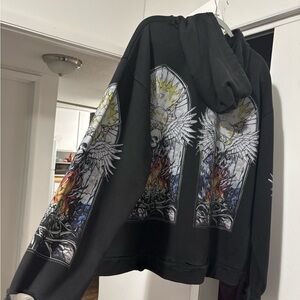 Black Graphic Winged Skull Hoodie with Colorful Stained-Glass Print